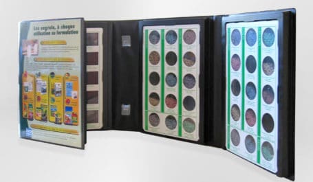 PVC display case with thermoformed wedge for powder or sand products