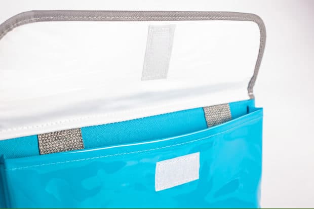 Large printed front pocket with two gussets and Velcro® closure flap