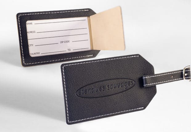 Luggage tag with address field under crystal-clear PVC film and elegant embossing.